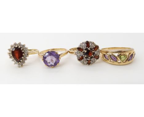 A garnet and clear gem flower cluster size O1/2, a 9ct garnet and cz cluster ring size N, a 9ct amethyst and peridot set band