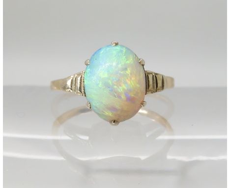 A yellow metal opal Art Deco ring size of opal approx 9.1mm x 7.4mm, size K, weight 1.7gms Condition Report: No hallmark has 