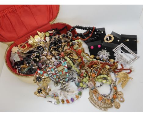 A box full of vintage beads, brooches etc Condition Report: No condition report available for this lot