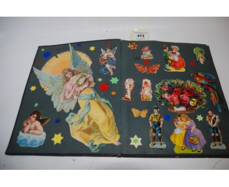 An album of vintage scraps all stuck down Condition Report: Available upon request