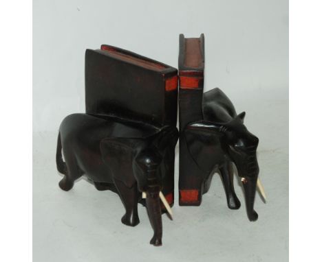 A pair of carved elephant bookends and an Art Deco style wall barometer Condition Report: Available upon request