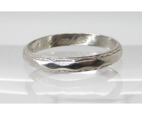 A platinum wedding ring size R1/2, weight 3.9gms Condition Report: Available upon request