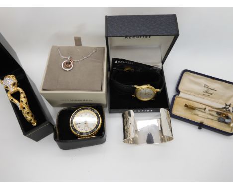 A silver cuff bangle by Francis Howard of Sheffield, a white metal Scottish agate inlaid horseshoe pin, items by Hot Diamonds