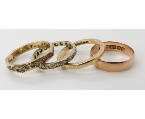 A 9ct rose gold wedding ring, size N1/2, a 9ct gold wedding ring size O and two gem set eternity rings, weight combined 7.7gm