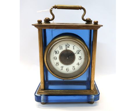 A blue glass and brass carriage clock Condition Report: Available upon request