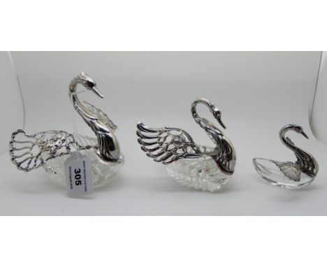 A graduated set of three continental white metal and glass trinket dishes modelled as swans Condition Report: All three are s