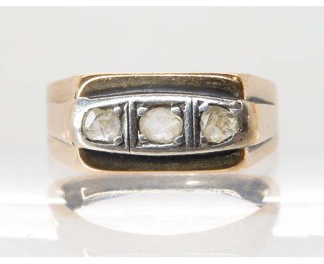 A yellow metal ring with Arabic hallmarks, set with three clear gems finger size P, weight 3.8gms Condition Report: Available
