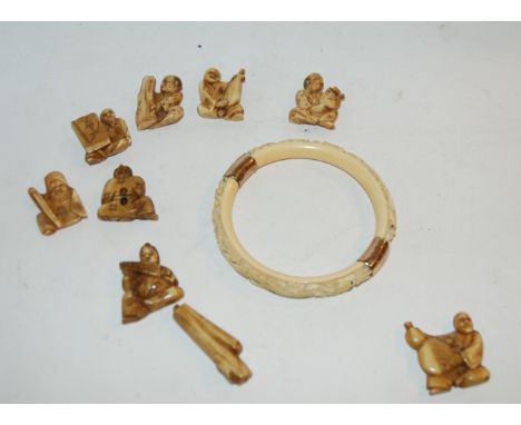 A carved ivory bangle and carved netsukes Condition Report: Available upon request
