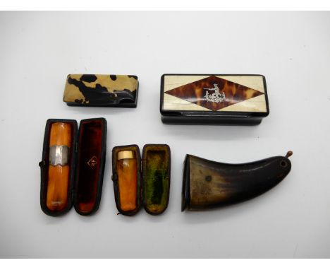 A lot comprising two cased amber cigarette holders, two snuff boxes and a pistol grip snuff box (5) Condition Report: Availab