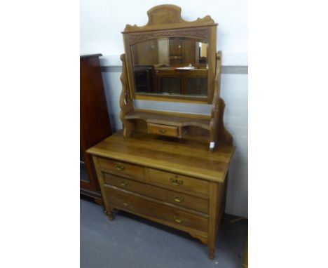 A LIGHT WALNUTWOOD DRESSING CHEST WITH THREE DRAWERS AND SWING MIRROR 