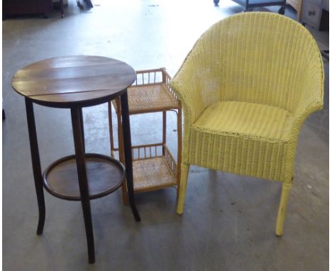 AN OAK TOPPED CIRCULAR BENTWOOD OCCASIONAL TABLE WITH UNDER SHELF, 1'7" DIAMETER AND A BAMBOO AND CANE TWO TIER WHAT-NOT