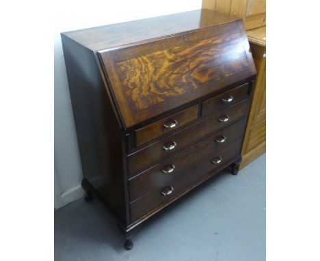 CIRCA 1920's OAK BUREAU, WITH TWO SHORT AND THREE LONG DRAWERS AND BRACKET FEET 