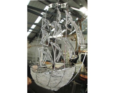 CEILING LIGHT, in the form of a galleon with three branches within a metal frame, 120cm H.