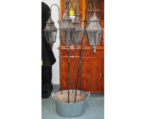 LANTERNS, a set of five, on stakes, in zinc planter, 150cm x 43cm x 15cm. (5)