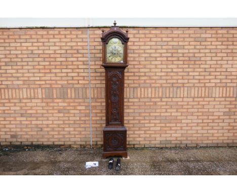 An 18th century 8-day longcase clock, 12” arched brass dial signed to a roundel in the arch for John Stokes, St. Ives, and nu