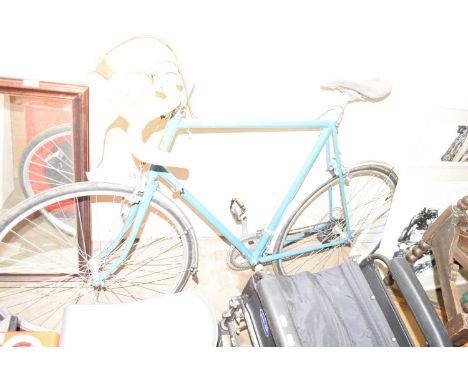 A vintage Raleigh racing bike possible Claude Butler Avant 1947-1948 together with a box of accessories