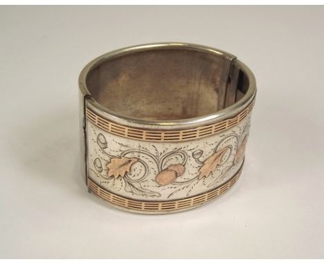 CUFF BANGLE.
A Victorian overlaid cuff bangle.
