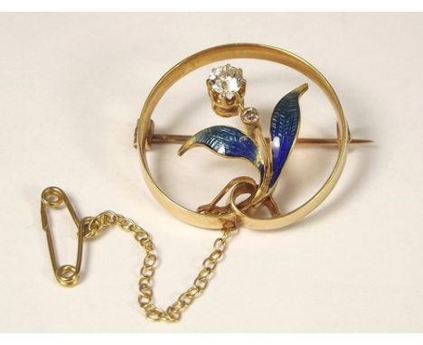 ENAMEL BROOCH.
A yellow metal flower spray brooch, the leaves with graduated enamel & set two colourless stones. Diameter 2.5