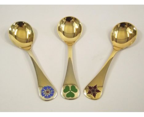 GEORG JENSEN.
Three Georg Jensen silver gilt & enamel year spoons for 1972, 1979 & 1984.