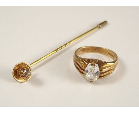 STICK PIN.
A 15ct. gold diamond solitaire stick pin & a gentleman's 9ct. gold stone set ring.