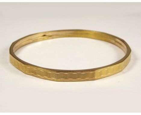SLAVE BANGLE.
A 9ct. 'gold shell' slave bangle.
