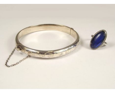 SILVER JEWELLERY.
An engraved silver bangle & a butterfly wing ring.