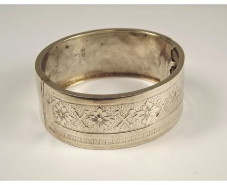 CUFF BANGLE.
A Victorian engraved cuff bangle with West's patent clasp.