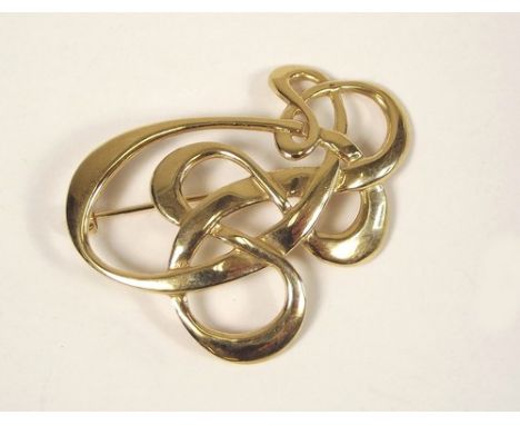 GOLD BROOCH.
A 9ct. gold stylised Celtic knot brooch. Approx. 8.6g.