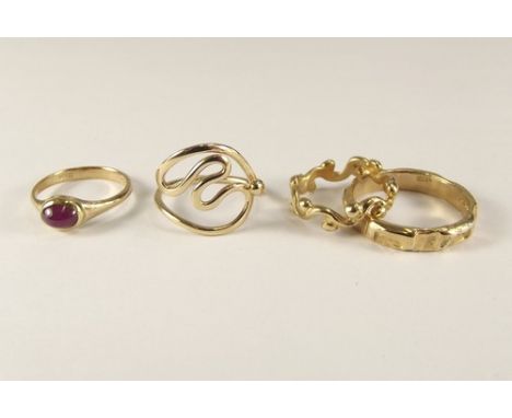 GOLD RINGS.
A 9ct. gold ruby set ring & three other 9ct. gold rings by John 'Red' Simpson, St. Ives.