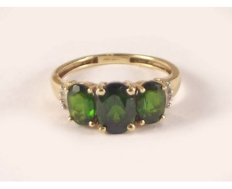 GOLD RING.
A 9ct. gold Russian green diopside & diamond ring. Size K.