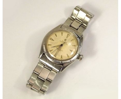 ROLEX WATCH.
A gentleman's early 1950's, stainless steel cased Rolex Oyster Perpetual chronometer & strap. The dial with arro