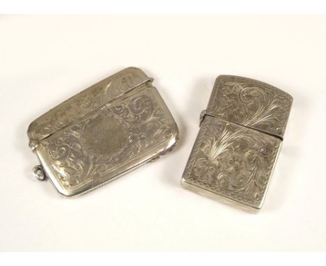 CIGARETTE LIGHTERS.
A silver vesta case converted as a cigarette lighter & one other cigarette lighter.