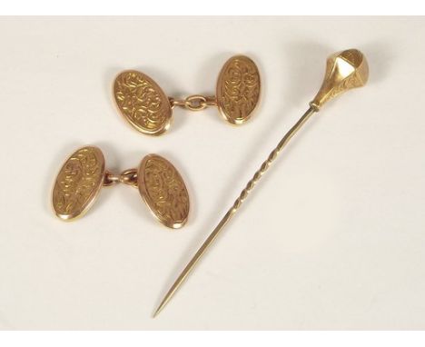 CUFFLINKS ETC.
A pair of 9ct. gold cufflinks, approx. 2.8g, & an engraved stick pin.