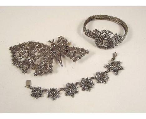 CUT STEEL.
A Victorian cut steel bangle, part of a cut steel buckle etc. 
