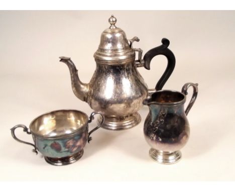 TEA SERVICE.
A 1970's three piece silver tea service, with applied decoration. 41oz.