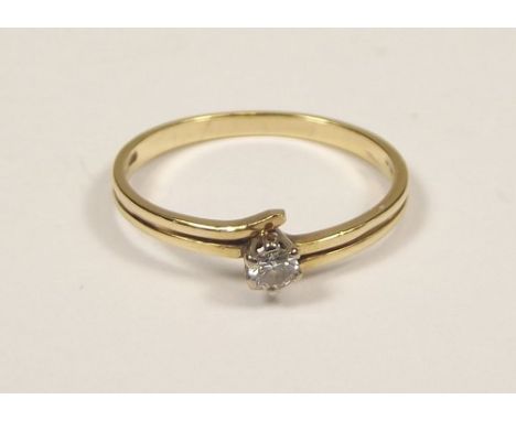 SOLITAIRE RING.
A 9ct. gold solitaire diamond ring. Size M.