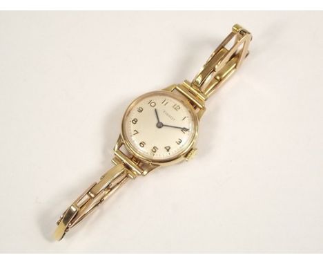 LADY'S WATCH.
A lady's gold plated Tissot wristwatch on 9ct. gold expanding strap.