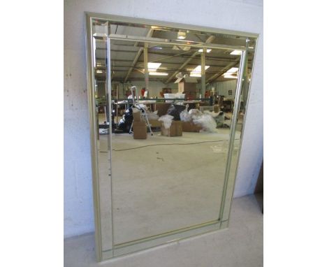 An Art Deco style mirror, overall size 107cm x 75cm.