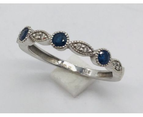 A 9ct white gold sapphire and diamond dress ring