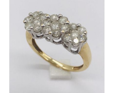A diamond cluster ring set in 18ct gold. Total weight 4.5g.