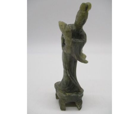 A Chinese carved jade figure of a female, height 12cm