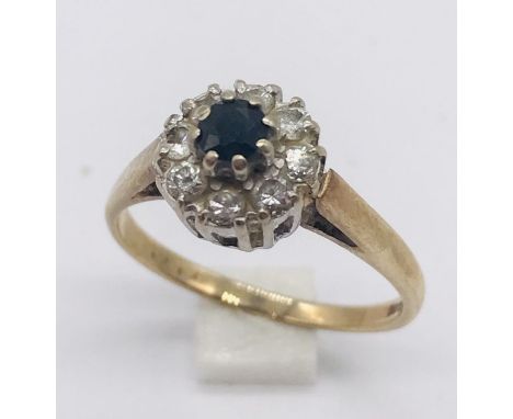 A 9ct gold diamond and sapphire cluster ring