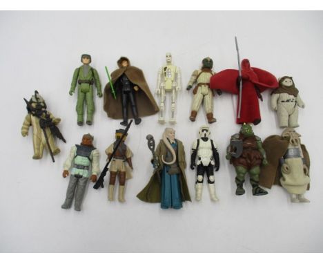 A collection of thirteen Star Wars original figurines (all dated 1983) including Luke Skywalker in cloak and light saber, Bik