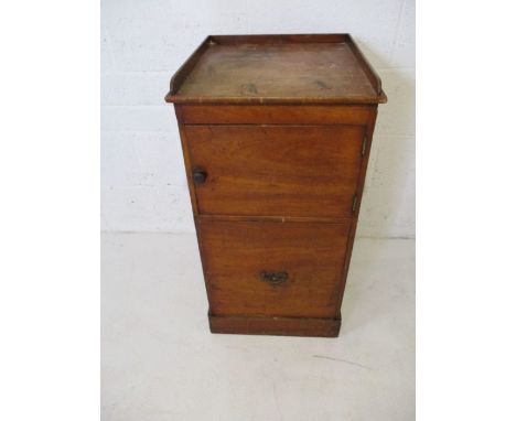 A Georgian mahogany commode with pull out seat and cupboard over 