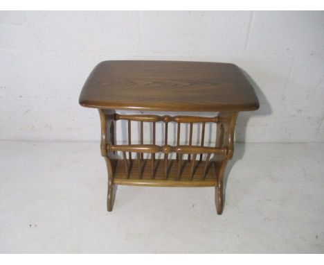 An Ercol "Golden Dawn" coffee table with magazine rack underneath