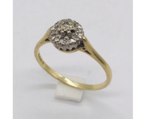 An 18ct gold diamond cluster ring. Total weight 2.7g.