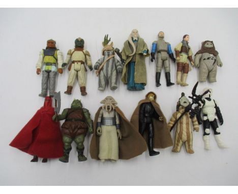 A collection of thirteen Star Wars original figurines (all dated 1983) including Luke Skywalker in cloak, Biker Scout Stormtr