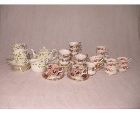 Three part tea sets by Royal Stafford, Royal Imperial and Grafton, along with a pair of Royal Albert cups and saucers.