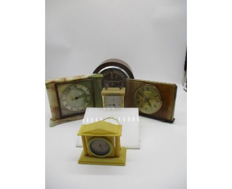 A collection clocks including a Smiths marble "Tempora" eight day floating balance clock, a marble Metamec clock, a Metamec q