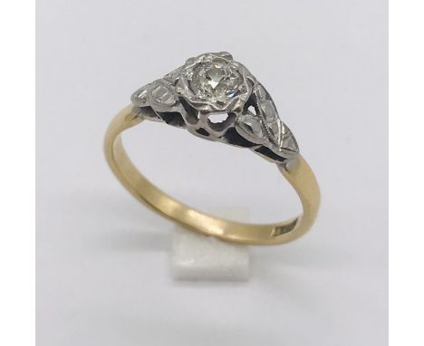 An 18ct gold illusion set diamond solitaire ring. Total weight 2.8g.
